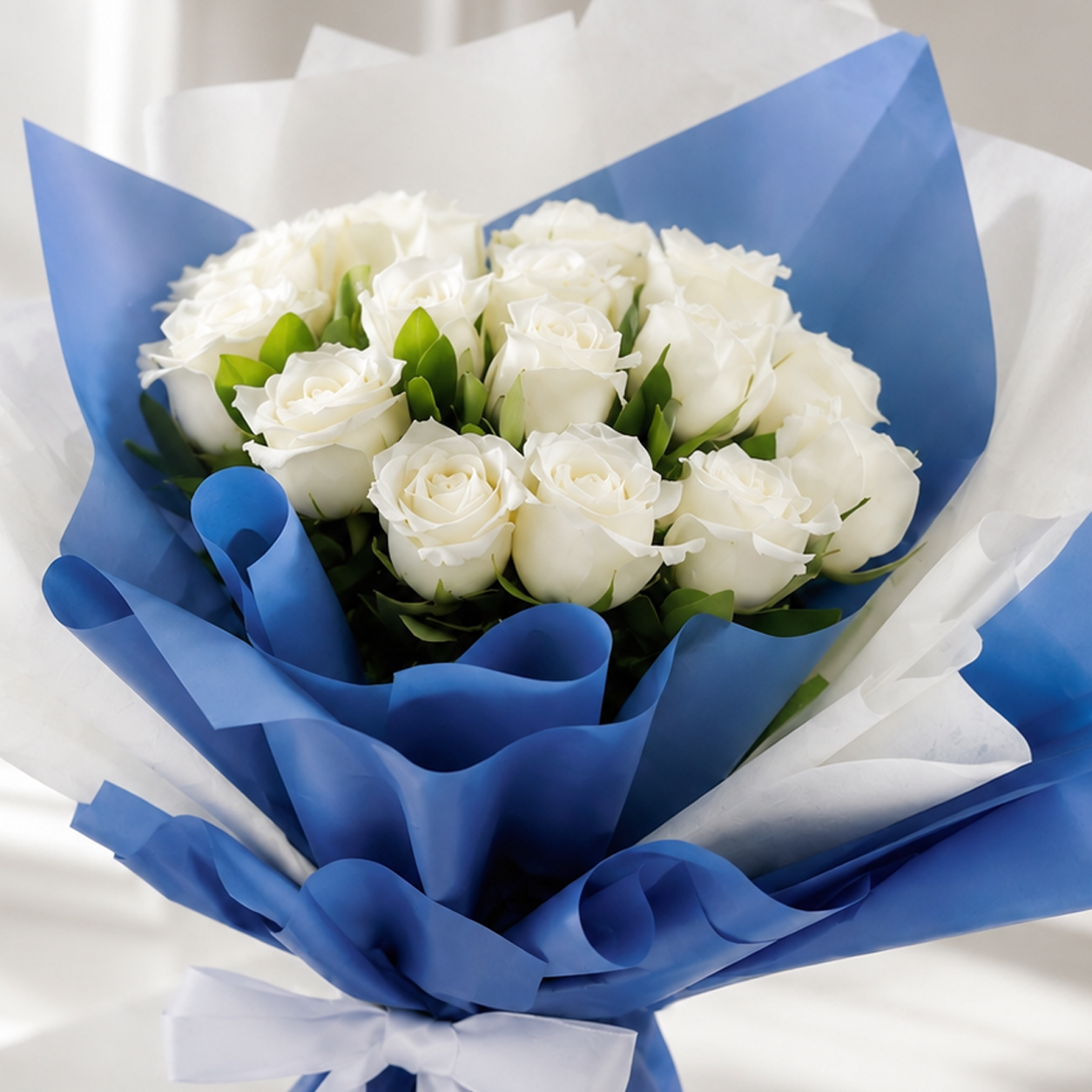 Elegant White Rose Bouquet Wrapped in Blue