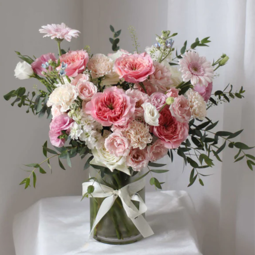 25 Assorted Light Pink Flowers in Elegant Arrangement