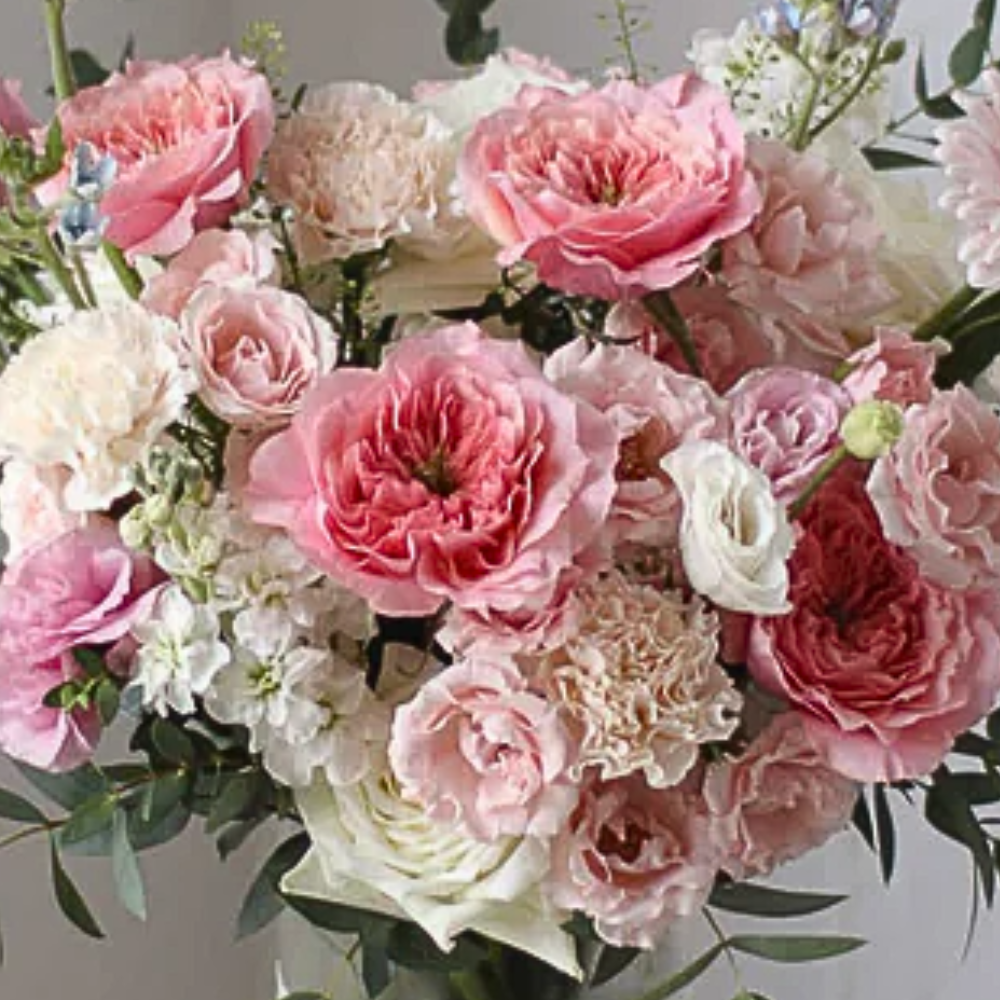25 Assorted Light Pink Flowers in Elegant Arrangement