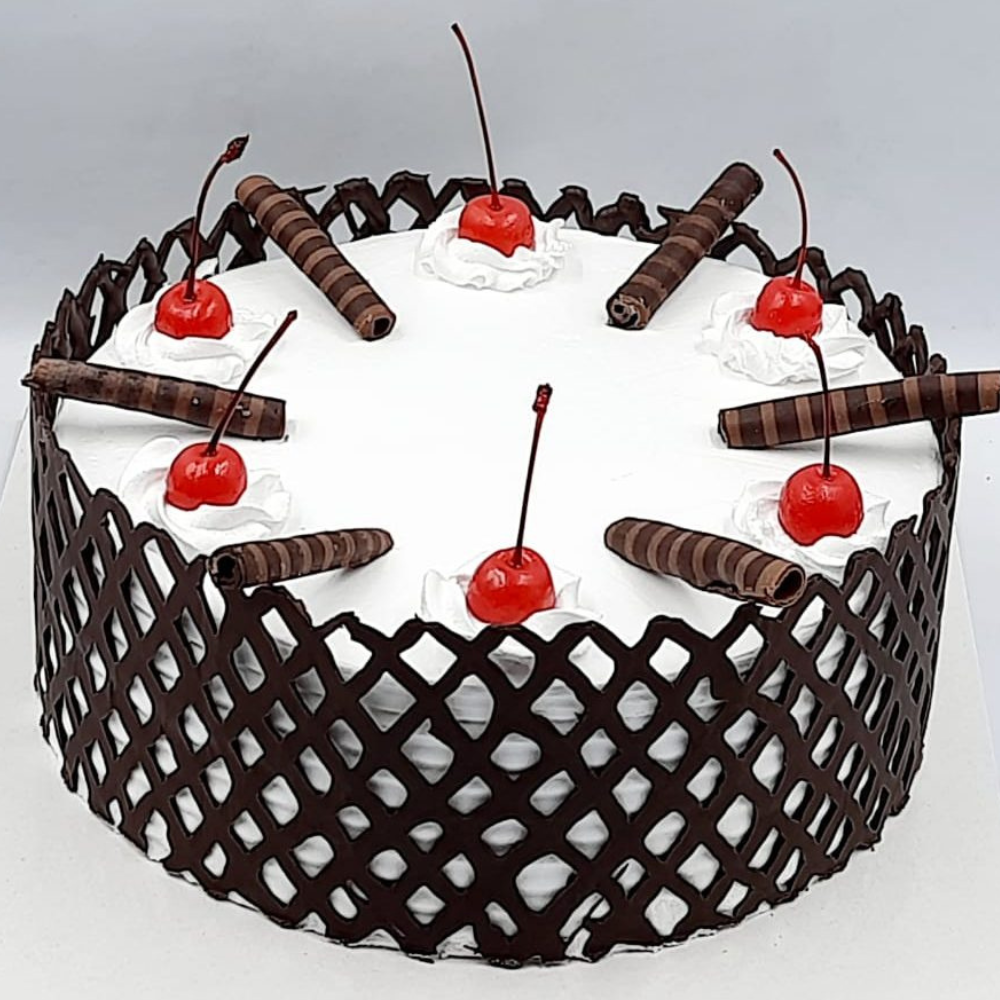 Elegant Black Forest Cake with Chocolate Garnish & Cherries