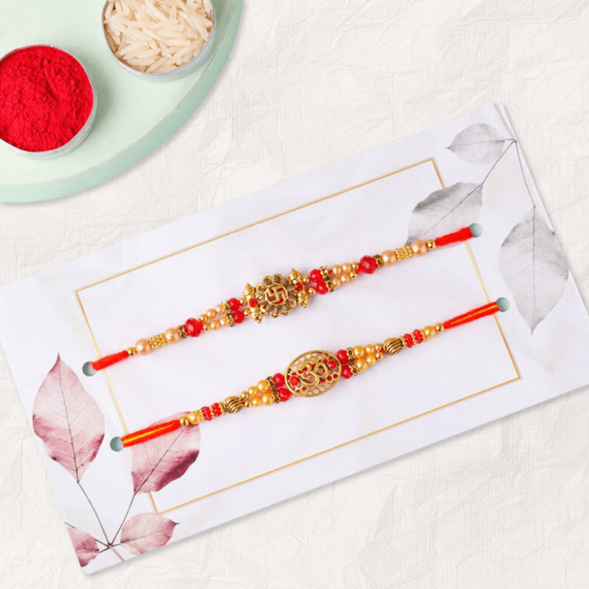 Om & Swastik Rakhi Set of 2 with Scrumptious Laddoo