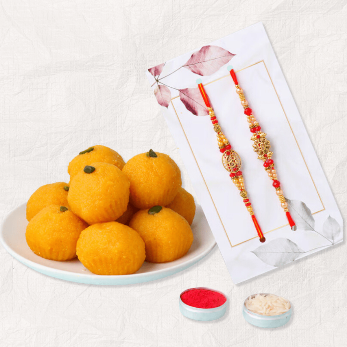 Om & Swastik Rakhi Set of 2 with Scrumptious Laddoo